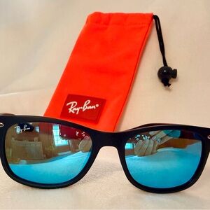 Ray-Ban Junior Black Sunglasses with blue mirrored lenses.